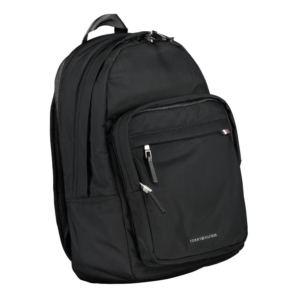 Backpack by Tommy Hilfiger for men in polyester black presents a stately Polyester Backpack design, showcasing a secure zipper with ample external-pockets & laptop-compartment and versatile handle, backpack-strap & adjustable-strap for a stately finish.
