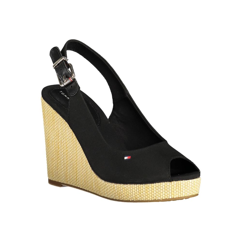 Wedge Sandals by Tommy Hilfiger for women in polyester polyethylene cotton and black presents a sculptural silhouette, showcasing the signature style of the Women's Polyester Polyethylene Cotton Wedge Sandals with a sculptural wedge and sculptural .