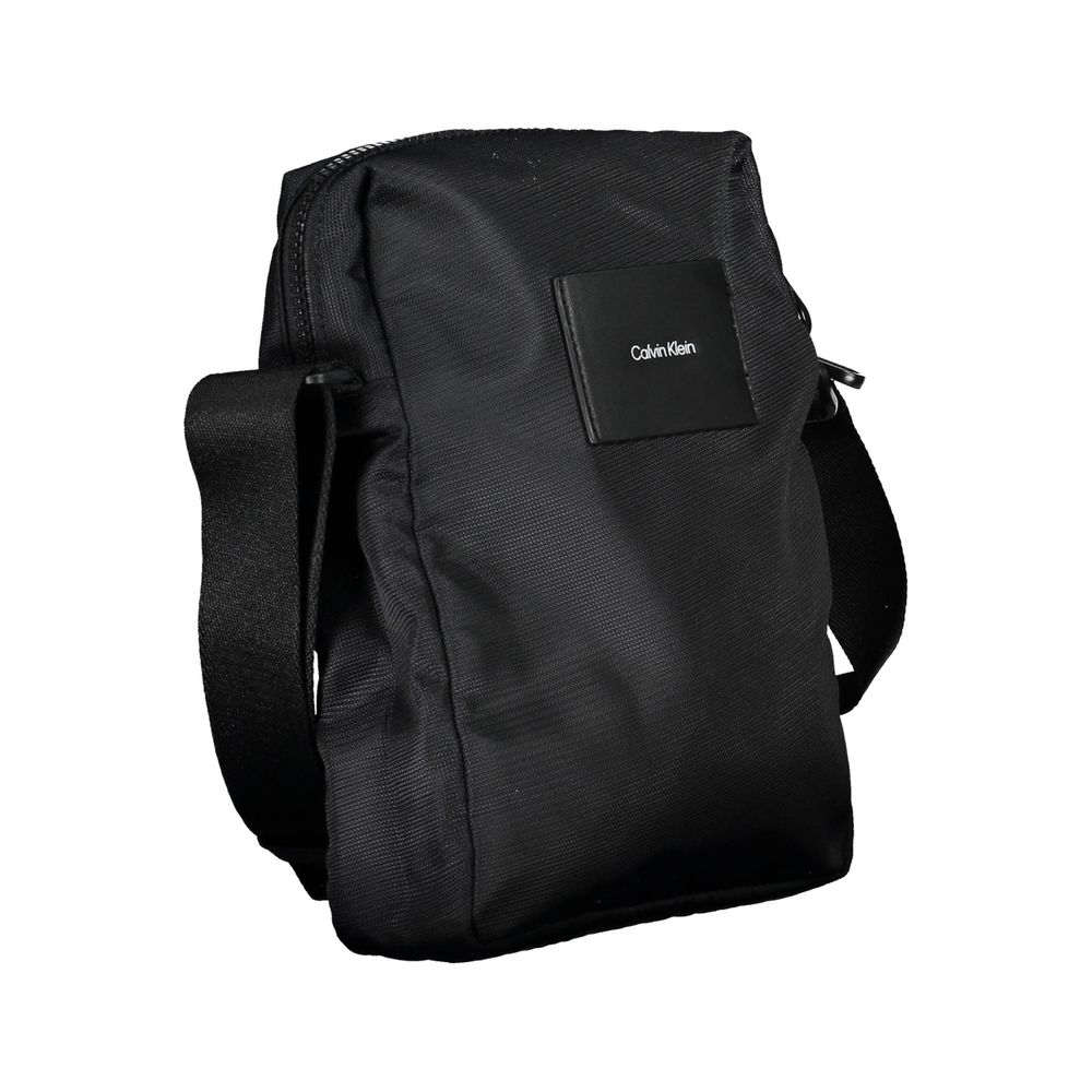 Shoulder Bag by Calvin Klein for men in polyester & polyurethane black features a statuesque silhouette, showcasing a secure zipper and statuesque internal-pockets with versatile shoulder-strap & adjustable-strap for a statuesque finish.