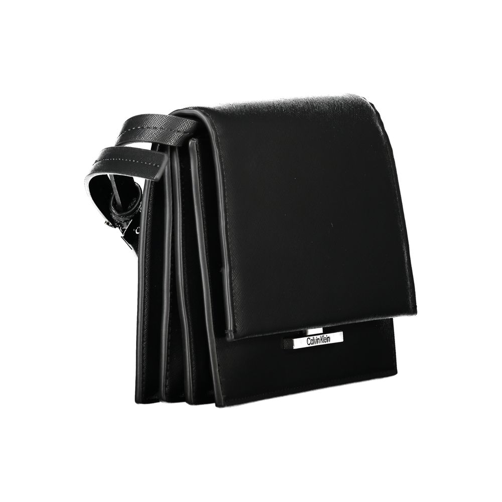 2-in-1 Shoulder & Crossbody Handbag by Calvin Klein for women in polyethylene faux leather black features an refined silhouette, showcasing a secure snap, ample built-in-compartments & internal-pockets, and versatile crossbody-strap, shoulder-strap & adjustable-strap for a sophisticated refined aesthetic.