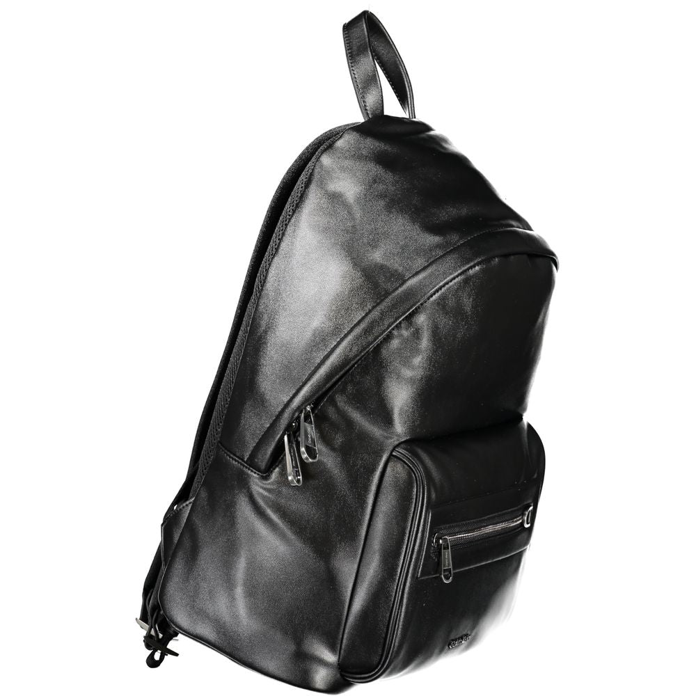 Backpack by Calvin Klein for men in polyester black showcases an architectural Polyester Backpack design, featuring a secure zipper, ample external-pockets, internal-pockets & laptop-compartment, and architectural handle, backpack-strap & adjustable-strap for a sophisticated look.