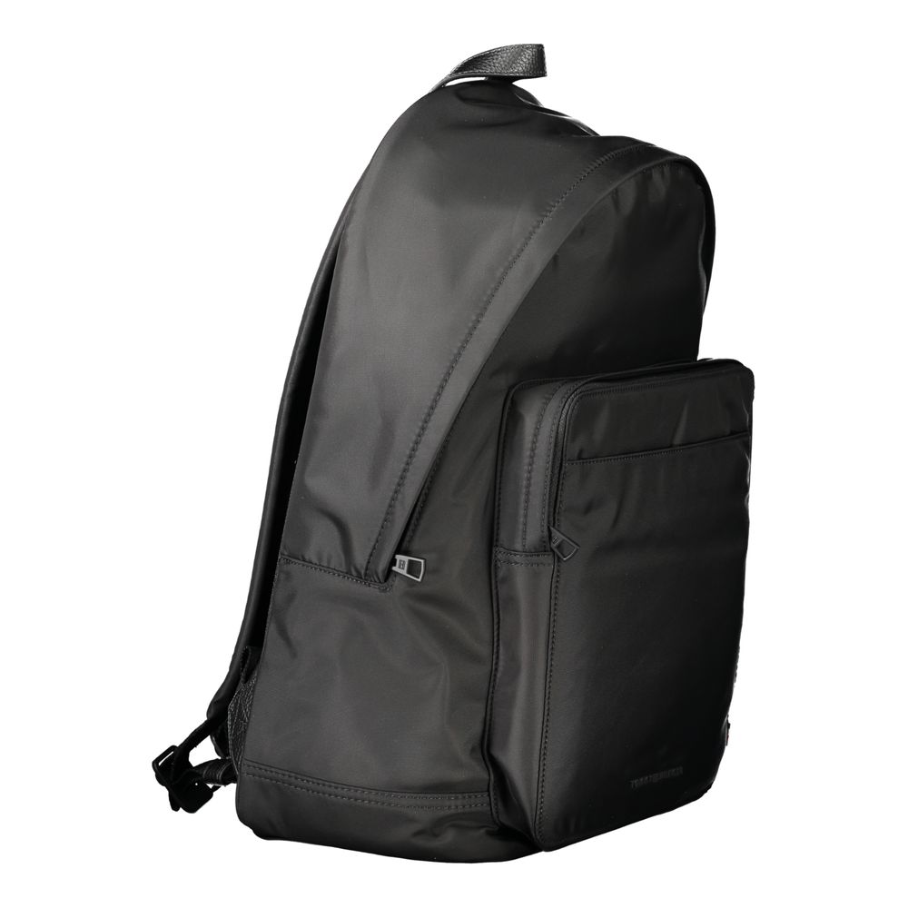 Backpack by Tommy Hilfiger for men in polyester black features a effortlessly chic Polyester Backpack design, showcasing a secure zipper, ample external-pockets, internal-pockets & laptop-compartment, and versatile handle, backpack-strap & adjustable-strap for a effortlessly chic finish.