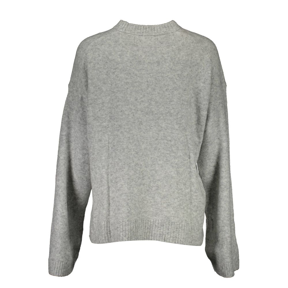 Sweater by Calvin Klein for women in wool gray showcases a discreet silhouette, finished with a discreet and for a discreet look.