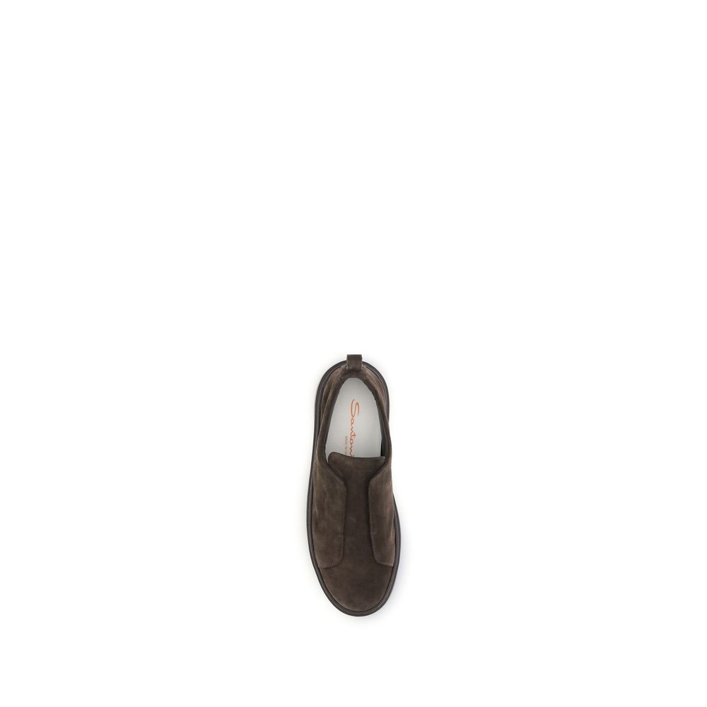 Sneakers by Santoni for men in bos taurus calf suede leather brown presents a sumptuous silhouette, artfully capturing the essence of the Men's Low Top Slip On Bos Taurus Calf Suede Leather Sneakers with its sumptuous low-top slip-on style design.