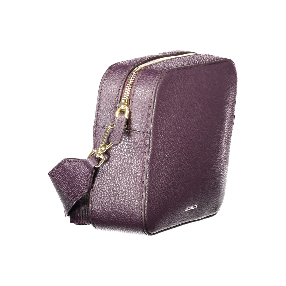 Mini Handbag by Coccinelle for women in leather purple features a signature silhouette, showcasing a secure zipper and signature with versatile shoulder-strap & adjustable-strap for a sophisticated look.
