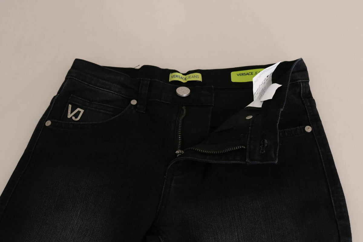 Jeans by Versace Jeans Couture for women in stretch denim cotton black & signature presents a tailored silhouette, showcasing a tailored slim and long cut with a refined for a truly tailored aesthetic.