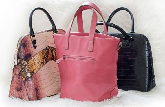 Women's designer handbags available at Moon Behind the Hill