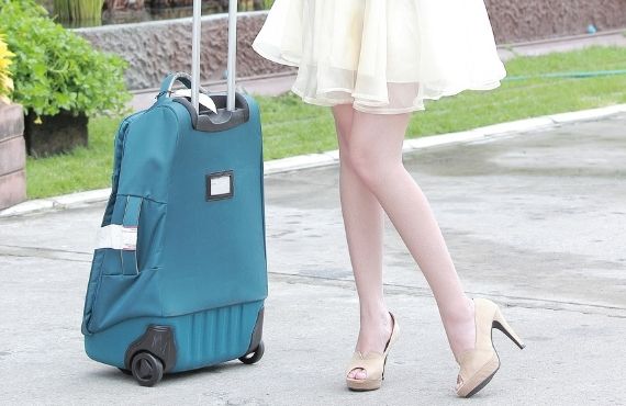 Women's designer luggae and travel bags available at Moon behind the Hill