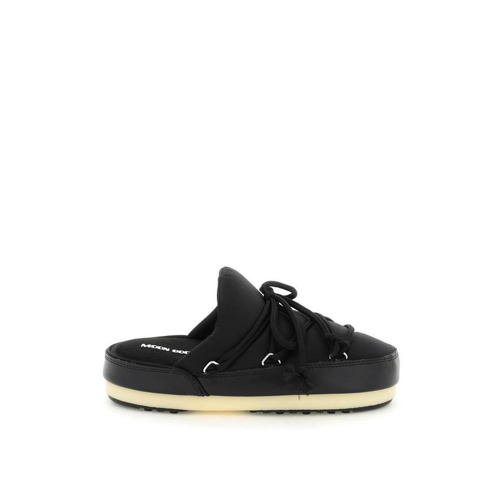 Mules Flat Shoes by Moon Boot for women in nylon black presents a effortless chic silhouette, showcasing the Icon Women's Nylon Mules Flat Shoes design with a effortless chic and for a sophisticated look.