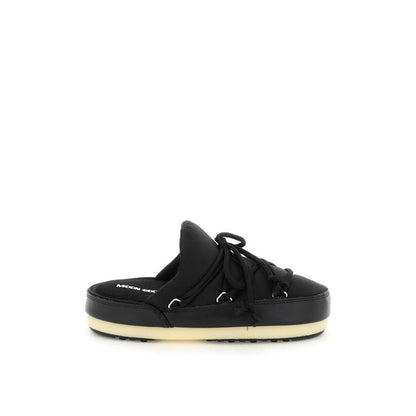 Mules Flat Shoes by Moon Boot for women in nylon black presents a effortless chic silhouette, showcasing the Icon Women's Nylon Mules Flat Shoes design with a effortless chic and for a sophisticated look.