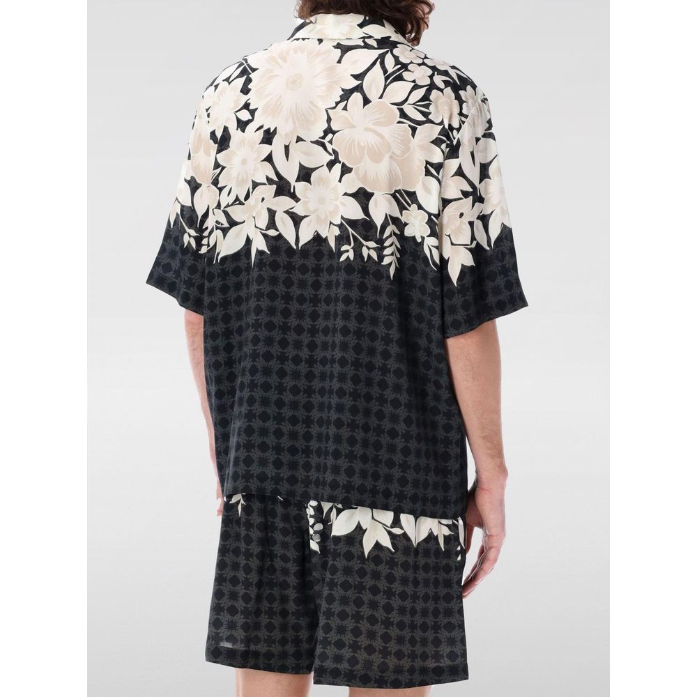 Shirt by Amiri for men in silk black, patterned, floral & print showcases a sharp silhouette, elegantly detailed with a sharp and sharp .
