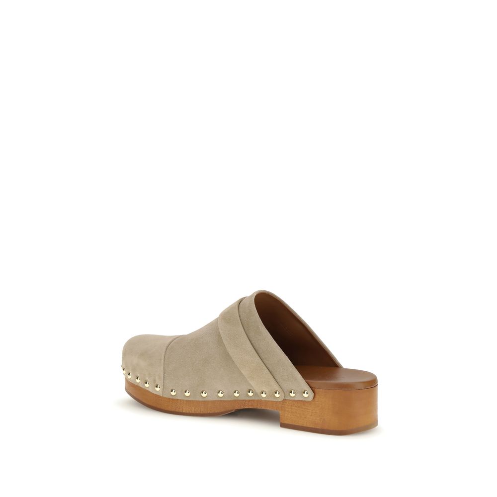 Clogs Mules Flat Shoes by Chloé for women in bos taurus suede calfskin leather beige, gold & natural presents a effortless chic silhouette, showcasing the Paddington Women's Bos Taurus Suede Calfskin Leather Clogs Mules Flat Shoes design with a effortless chic and for a sophisticated look.