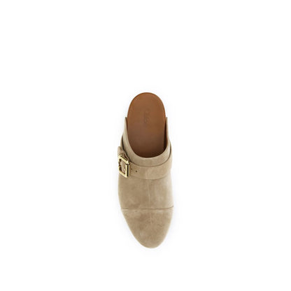 Clogs Mules Flat Shoes by Chloé for women in bos taurus suede calfskin leather beige, gold & natural features an captivating silhouette, showcasing the captivating style of the Paddington Women's Bos Taurus Suede Calfskin Leather Clogs Mules Flat Shoes with its distinct and refined .