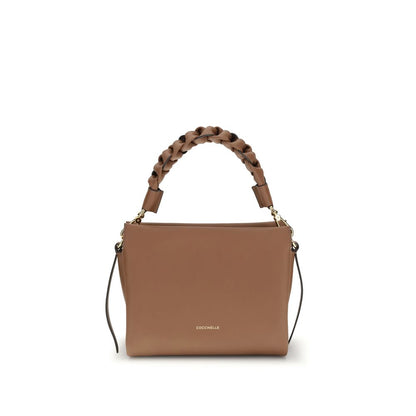 Crossbody Handbag by Coccinelle for women in bos taurus calf leather beige, signature & monogram features a refined silhouette, showcasing a secure zipper, organized , and versatile crossbody-strap, shoulder-strap, handle & adjustable-strap for a refined finish.