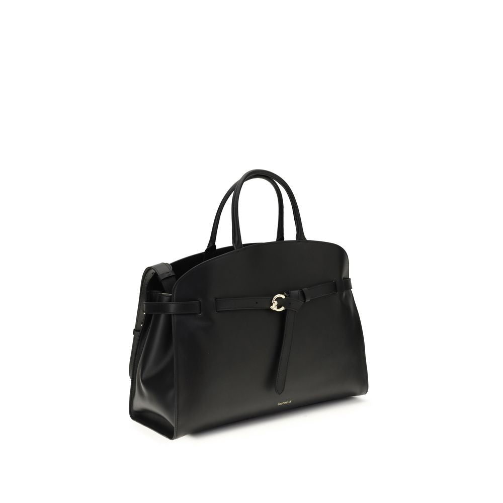 Large Handbag by Coccinelle for women in bos taurus calf leather black & gold features a contemporary silhouette, showcasing a secure magnetic & buckle, ample , and contemporary shoulder-strap, adjustable-strap & belt-strap for a sophisticated look.