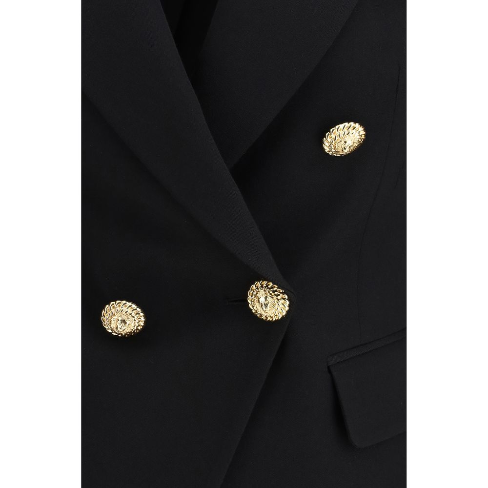 Jacket by Balmain for women in wool black showcases a contemporary silhouette, detailed with a contemporary and premium pockets for a sophisticated finish.