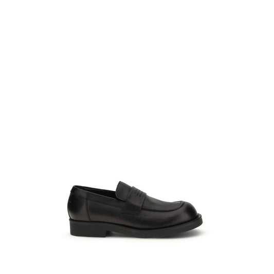 Flat Loafer Slip-On Shoes by MM6 for men in bos taurus calf leather black features an dynamic silhouette from the Men's Bos Taurus Calf Leather Flat Loafer Slip-On Shoes collection, defined by a dynamic round toe style and flat for a dynamic look.