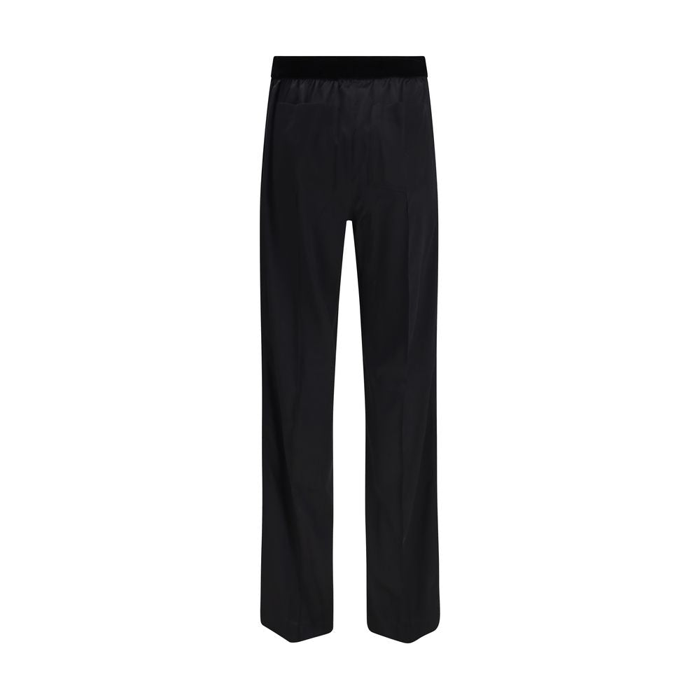 Trousers by Tom Ford for women in silk satin black presents a perennial silhouette, meticulously tailored with a relaxed-fit & regular-fit cut, long finish, and an elegant .