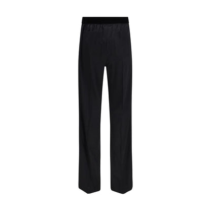 Trousers by Tom Ford for women in silk satin black presents a perennial silhouette, meticulously tailored with a relaxed-fit & regular-fit cut, long finish, and an elegant .