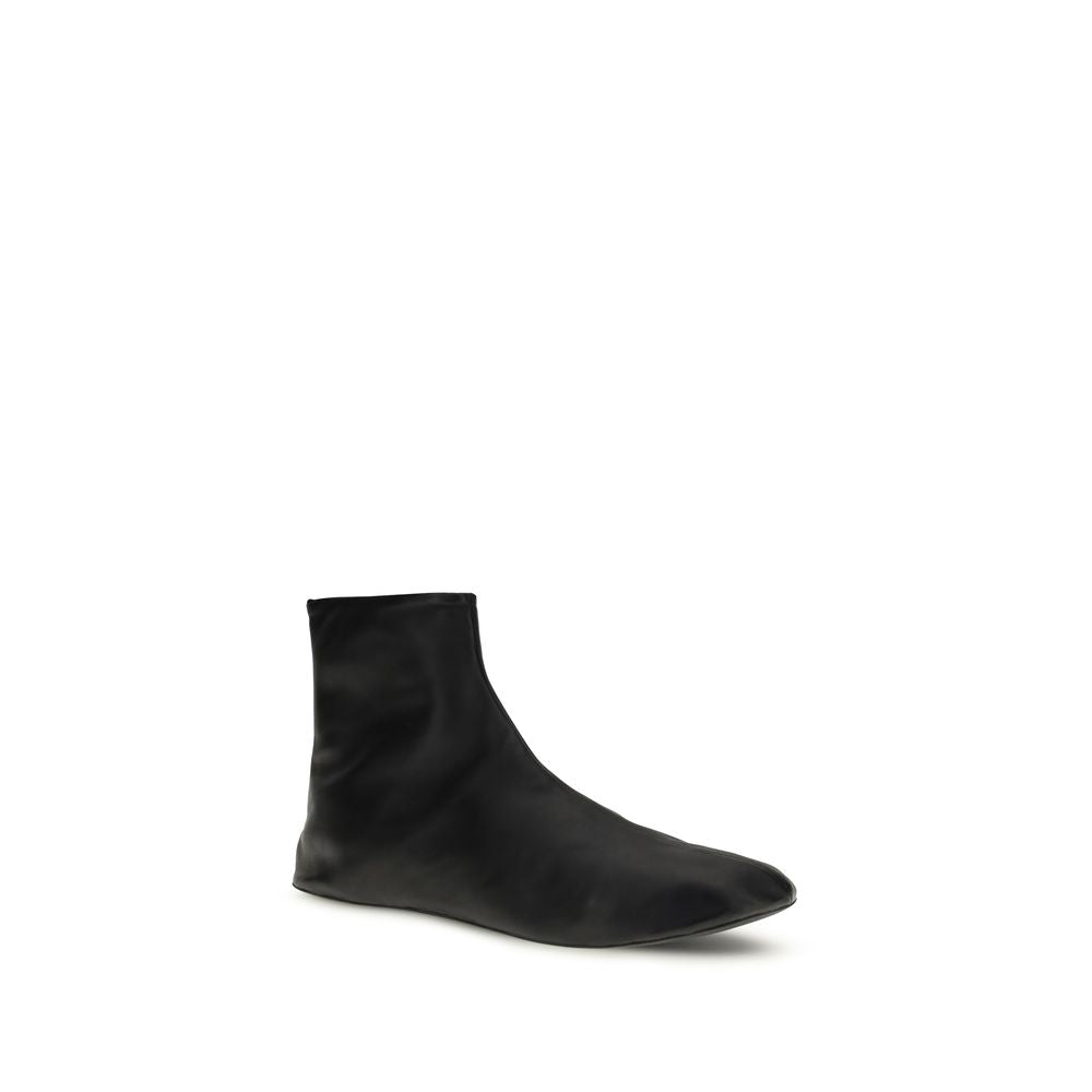 Ankle Boots by The Row for women in leather & rubber black features an avant-garde Women's Leather & Rubber Ankle Boots silhouette, defined by a sophisticated and a avant-garde .