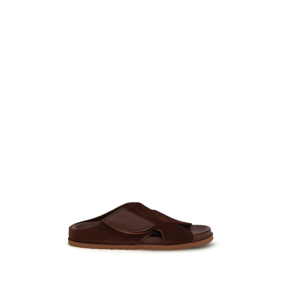 Flat Sandals by Pedro García for women in eva & bos taurus suede cowhide leather brown, natural & signature presents a sculptural silhouette, showcasing the Women's EVA & Bos Taurus Suede Cowhide Leather Flat Sandals design with a sculptural flat and for a premium look.