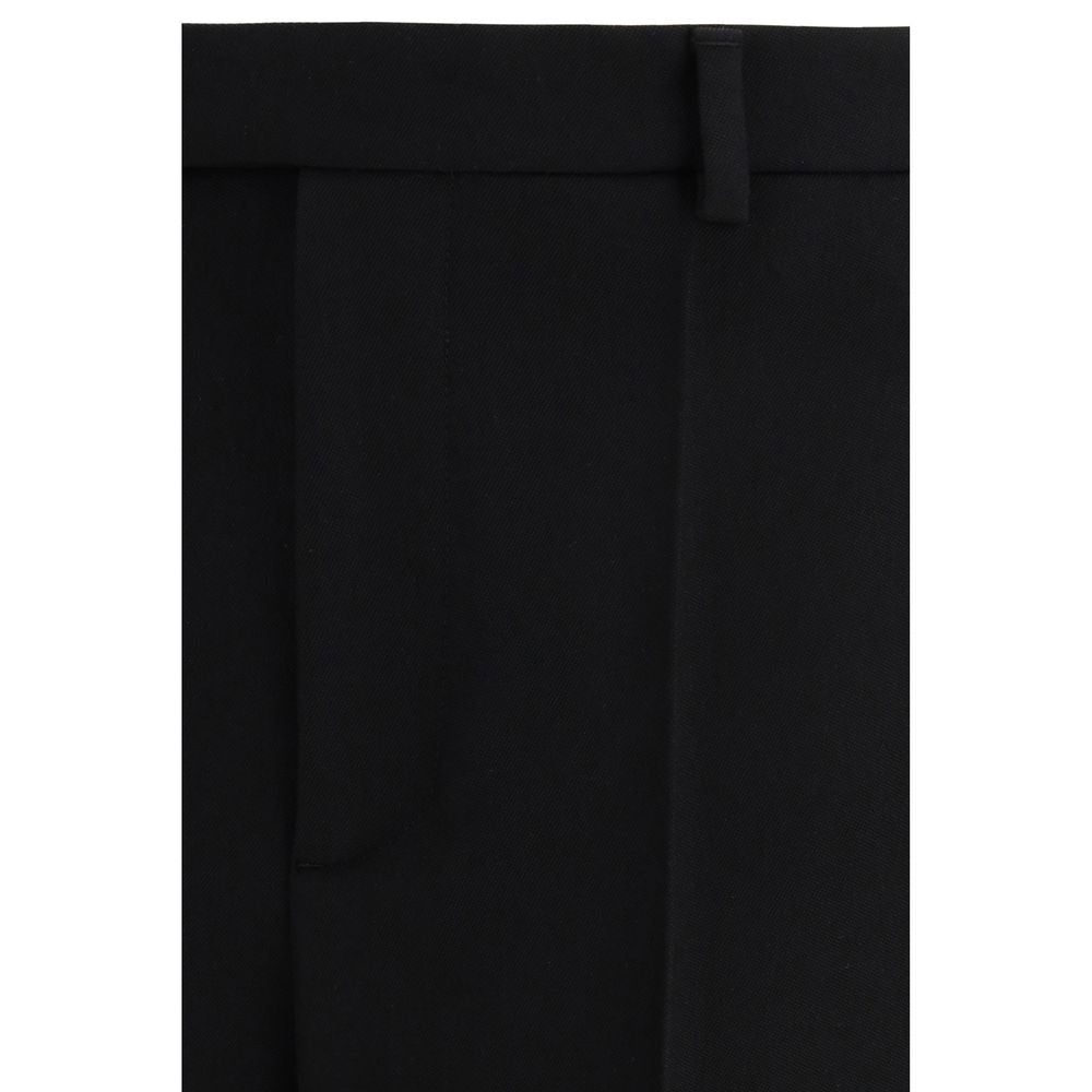 Trousers by Valentino Garavani for men in virgin wool black & signature features a artisanal silhouette, showcasing a sophisticated regular-fit with a long and for a artisanal finish.