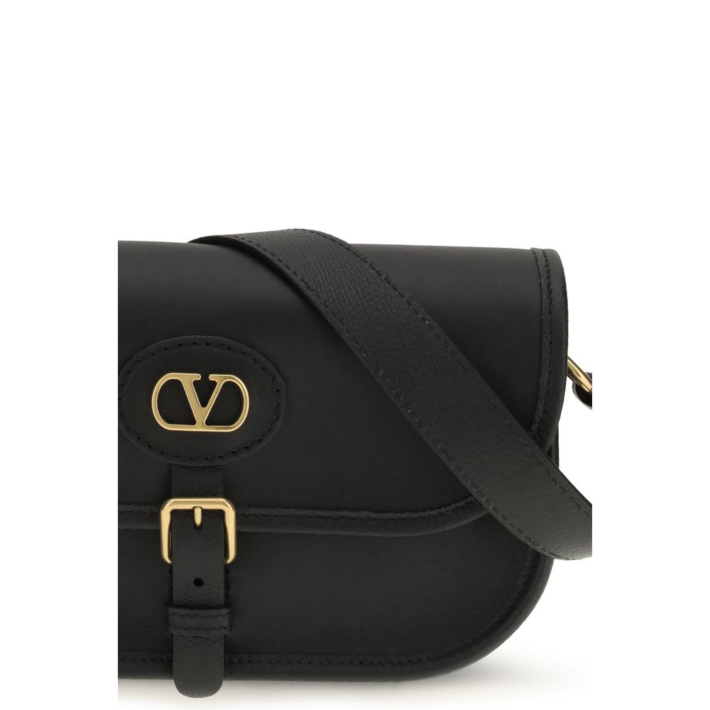 Small Shoulder Bag by Valentino Garavani for men in bos taurus calf suede leather black, gold & signature features a effortless chic silhouette with a secure magnetic, ample cardholder, and versatile shoulder-strap & adjustable-strap for a effortless chic finish.