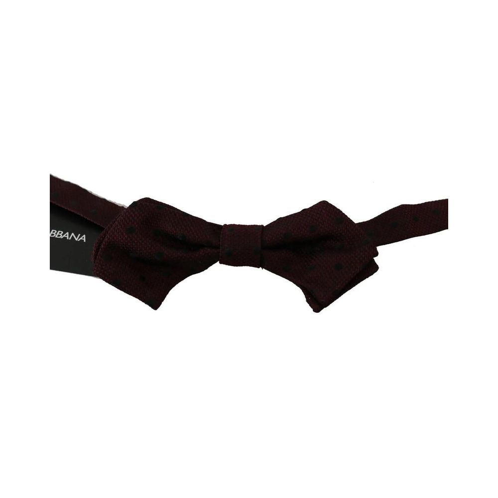 Necktie by Dolce & Gabbana for men in silk multicolor & purple showcases a stately silhouette, expertly detailed with a stately finish that perfectly captures the sophisticated essence of the Silk Necktie.