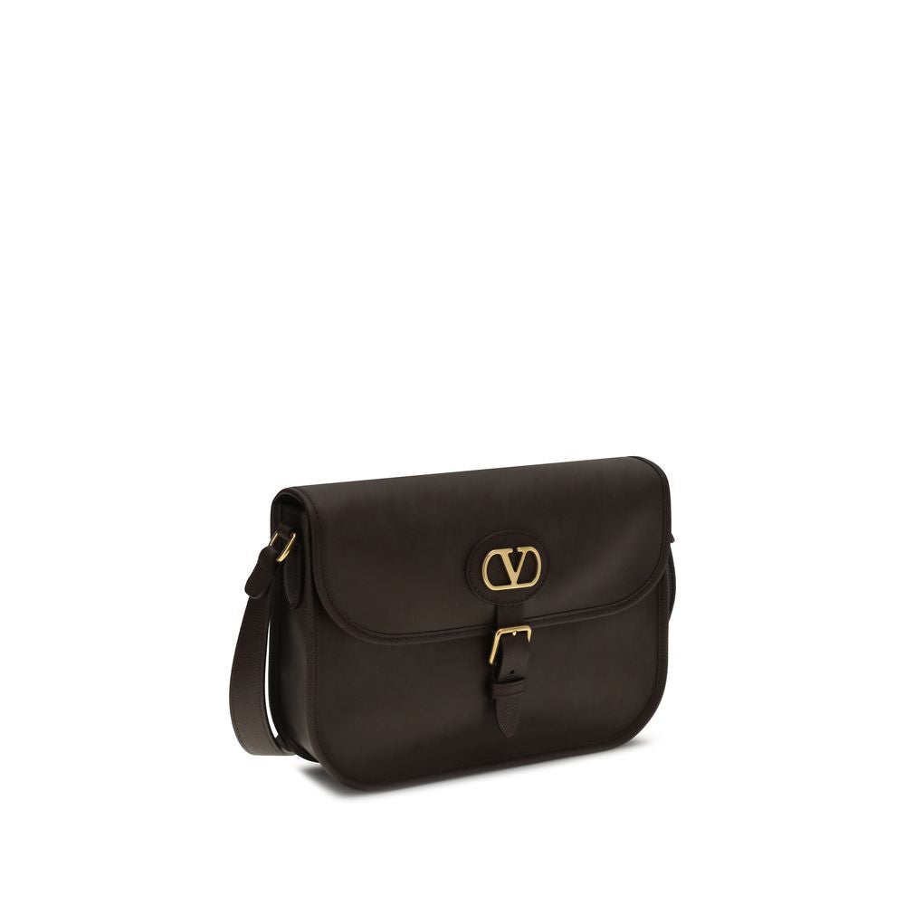Shoulder Flap Bag by Valentino Garavani for men in bos taurus suede calfskin leather brown features a enviable silhouette, showcasing a secure flap, magnetic & button, ample cardholder, and enviable shoulder-strap & adjustable-strap for a enviable finish.