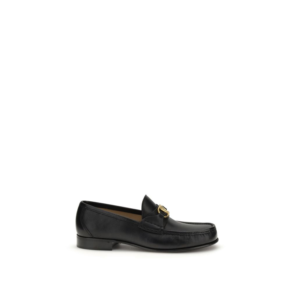 Loafer Slip-On Shoes by Valentino Garavani for men in buffalo & calf leather black & signature showcases a resplendent V Logo Men's Buffalo & Calf Leather Loafer Slip-On Shoes aesthetic, defined by its resplendent and elegant .