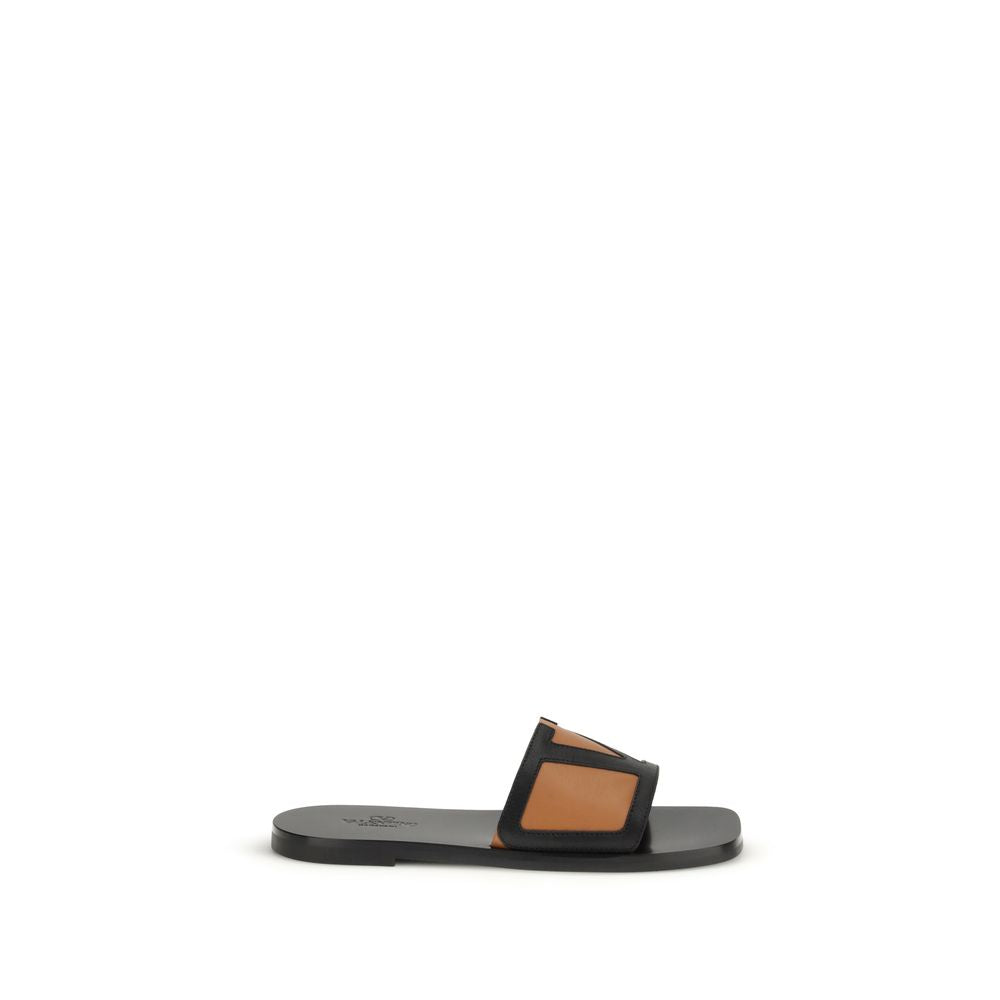 Flat Slider Sandals by Valentino Garavani for men in bos taurus calf leather black & signature features an exquisite silhouette, showcasing the exquisite Viva Superstar V Logo Men's Bos Taurus Calf Leather Flat Slider Sandals with a flat and .