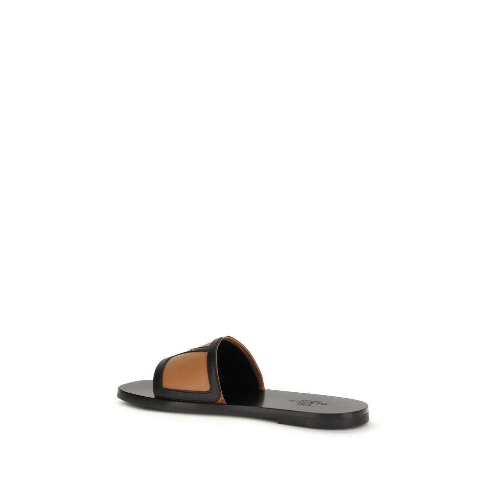 Flat Slider Sandals by Valentino Garavani for men in bos taurus calf leather black & signature presents a sculptural silhouette, showcasing the Viva Superstar V Logo Men's Bos Taurus Calf Leather Flat Slider Sandals design with a sculptural flat and for a premium look.