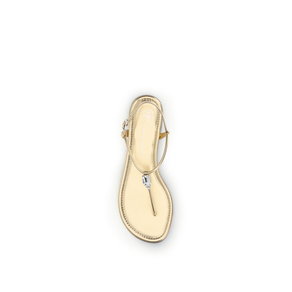 Flat Flip-Flop Sandals by Giuseppe Zanotti for women in bos taurus calf leather & rhinestone gold showcases a sculptural silhouette as Women's Bos Taurus Calf Leather & Rhinestone Flat Flip-Flop Sandals, defined by a sculptural flat and sculptural for a sculptural look.