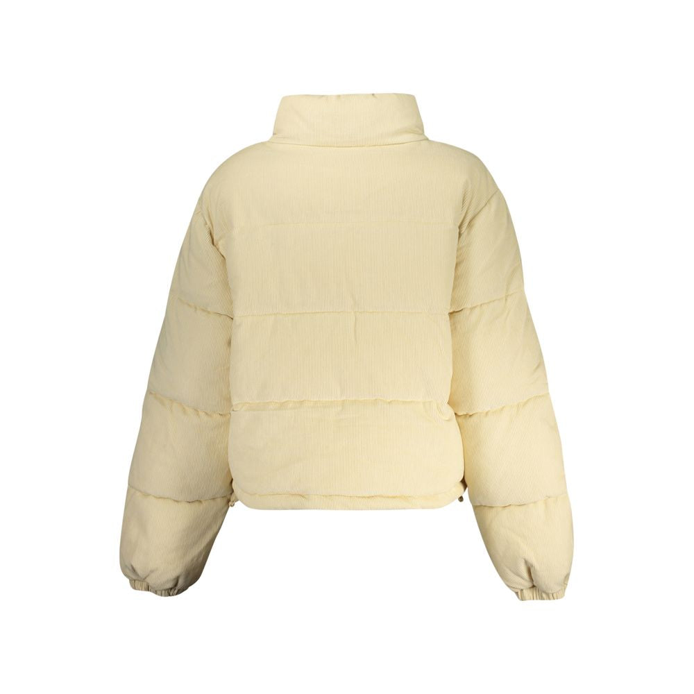 Overcoat by Guess Jeans for women in polyester beige features an voluminous silhouette, showcasing distinct pockets and a voluminous for a truly voluminous aesthetic.