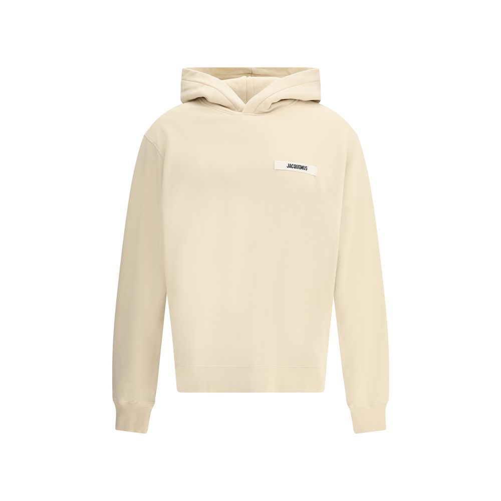 Sweatshirt Hoodie by Jacquemus for men in cotton beige & signature features an avant-garde silhouette, showcasing a sophisticated hooded neckline and detail for a truly avant-garde finish.