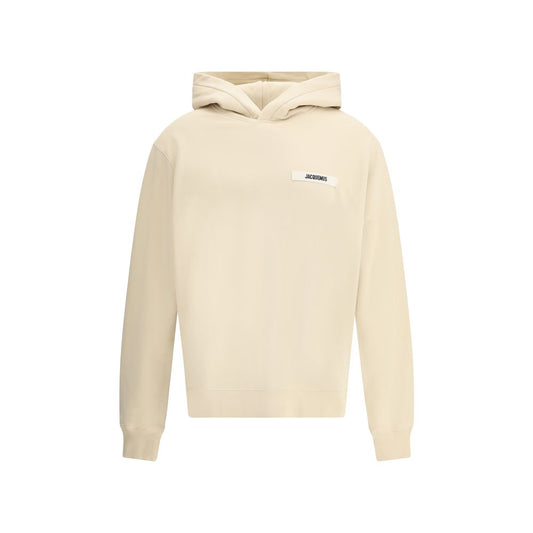 Sweatshirt Hoodie by Jacquemus for men in cotton beige & signature features an avant-garde silhouette, showcasing a sophisticated hooded neckline and detail for a truly avant-garde finish.