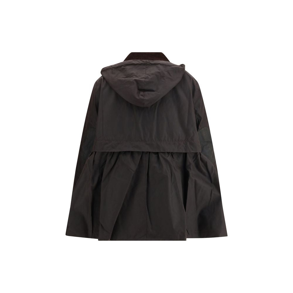 Overcoat by Barbour for women in cotton polyester brown & tartan features a cosy chic silhouette, artfully detailed with a sophisticated and premium for a cosy chic finish.