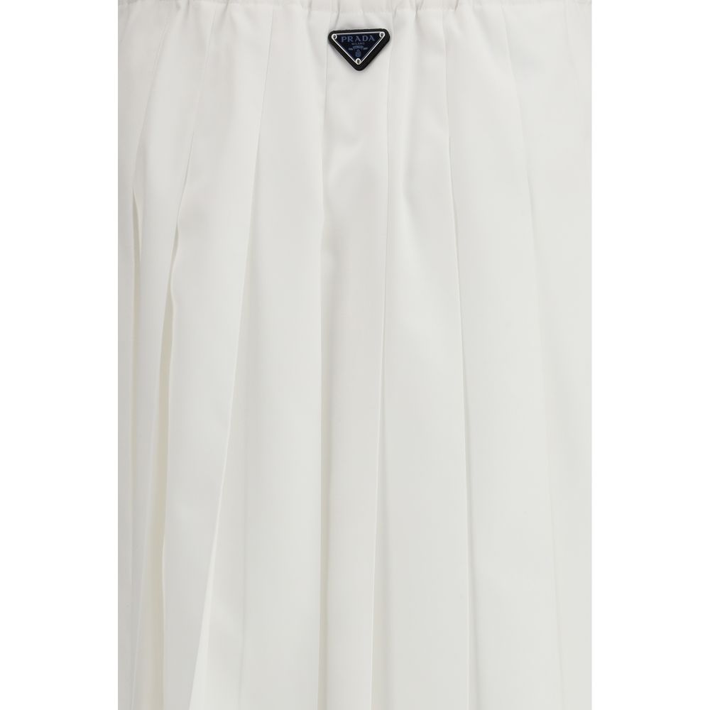 Skirt by Prada for women in cotton polyester white & signature features a captivating silhouette, showcasing the captivating Women's Pleated Cotton Polyester Long Skirt design with a sophisticated long for a captivating look.