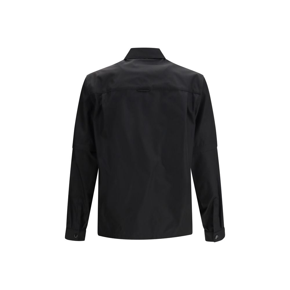 Jacket by Prada for men in polyamide plastic textile black features an utilitarian silhouette with a refined , showcasing sophisticated pockets for an utilitarian aesthetic.