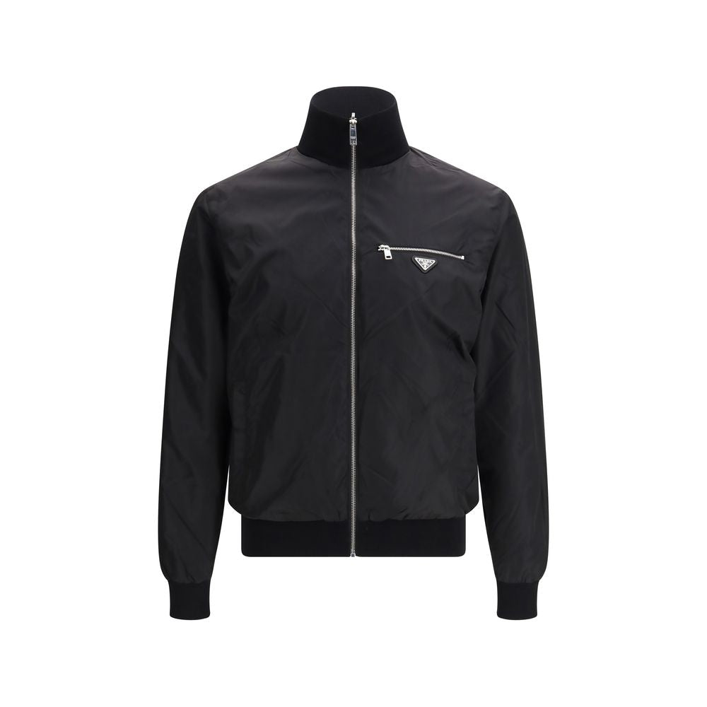 Bomber Jacket by Prada for men in virgin wool & polyamide black & signature features a dramatic silhouette, showcasing a sophisticated stand-collar neckline and distinctive pockets for a dramatic aesthetic.