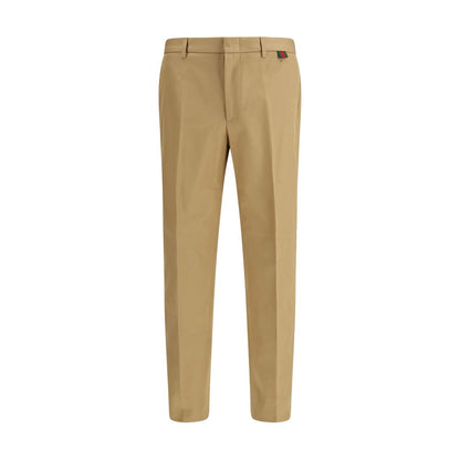 Trousers by Gucci for men in cotton beige presents a perennial silhouette, meticulously tailored with a regular-fit cut, long finish, and an elegant .