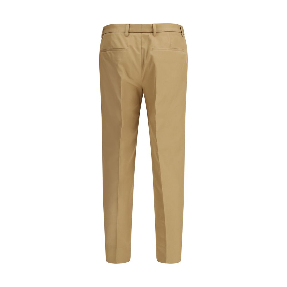 Trousers by Gucci for men in cotton beige features a sculptural silhouette, showcasing a sculptural regular-fit and long with a sophisticated for a sculptural finish.