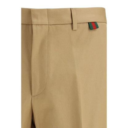 Trousers by Gucci for men in cotton beige features a sculptural silhouette, showcasing a sculptural regular-fit and long with a sophisticated for a sculptural finish.