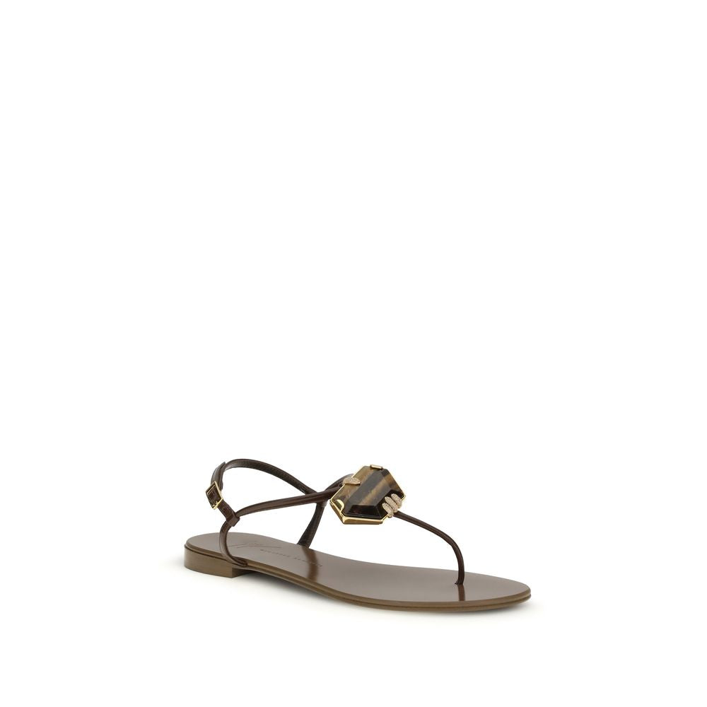 Flat Thong Sandals by Giuseppe Zanotti for women in leather & stainless steel brown features an exquisite silhouette, showcasing the exquisite Women's Leather & Stainless Steel Flat Thong Sandals with a flat and .