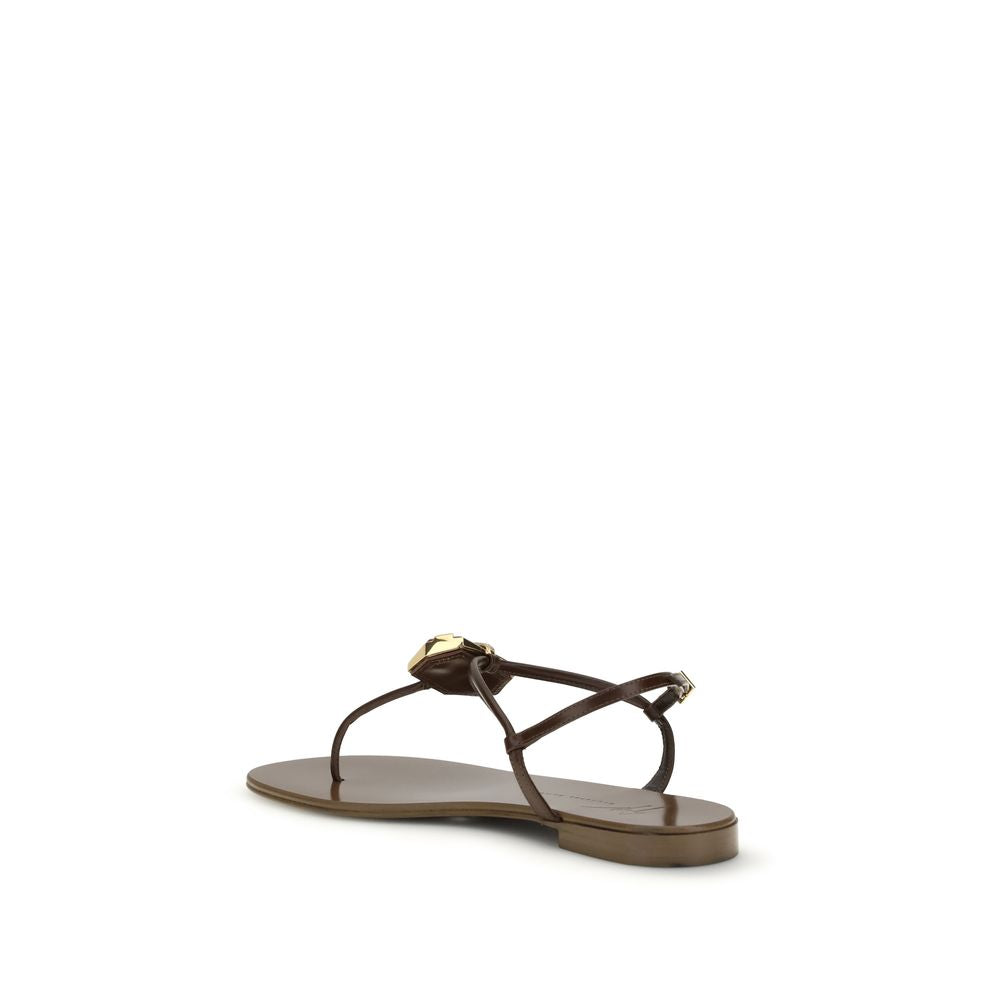 Flat Thong Sandals by Giuseppe Zanotti for women in leather & stainless steel brown showcases a sculptural silhouette as Women's Leather & Stainless Steel Flat Thong Sandals, defined by a sculptural flat and sculptural for a sculptural look.
