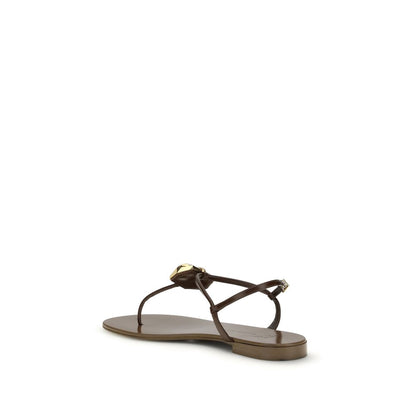 Flat Thong Sandals by Giuseppe Zanotti for women in leather & stainless steel brown showcases a sculptural silhouette as Women's Leather & Stainless Steel Flat Thong Sandals, defined by a sculptural flat and sculptural for a sculptural look.