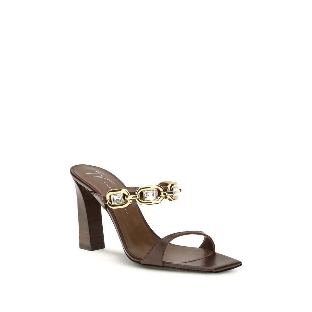 Mules Sandals by Giuseppe Zanotti for women in bos taurus calf leather and brown & gold presents a captivating silhouette, showcasing the signature style of the Women's Bos Taurus Calf Leather Mules Sandals with a captivating and captivating square toe style.