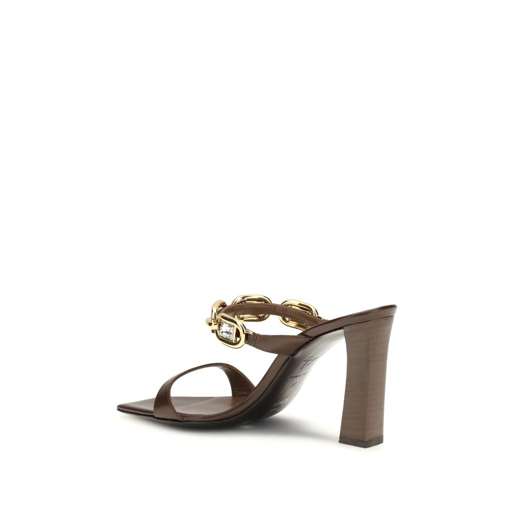 Mules Sandals by Giuseppe Zanotti for women in bos taurus calf leather brown & gold features an effortlessly chic silhouette from the Women's Bos Taurus Calf Leather Mules Sandals collection, showcasing a effortlessly chic and elegant square toe style.