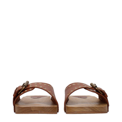 Flat Clogs Slippers by Isabel Marant for women in leather & rubber brown features an effortless chic silhouette from the Women's Leather & Rubber Flat Clogs Slippers collection, showcasing a flat and effortless chic open toe style.