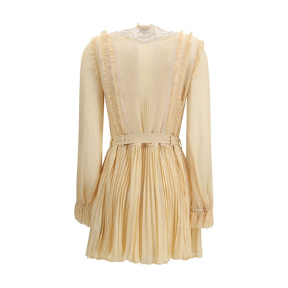 Dress by Self-Portrait for women in polyester & viscose cream features an eye catching silhouette with a sophisticated , elegant , and a refined short mini for a eye catching aesthetic.